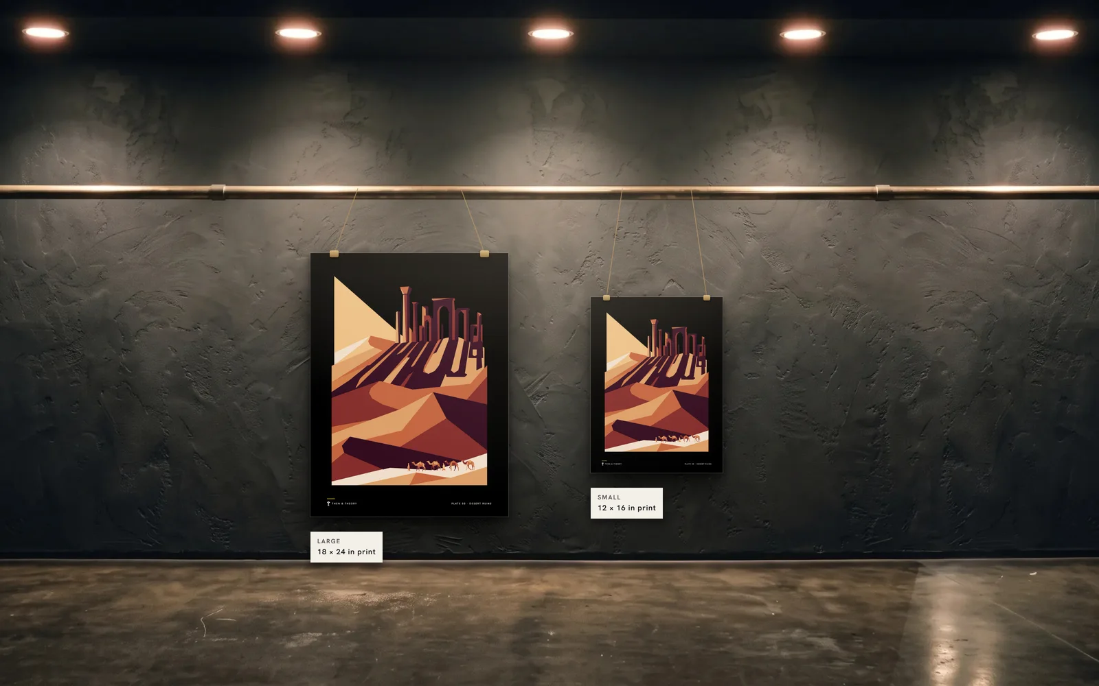 The two sizes to scale on the same wall: an 18 × 24 in print beside a 12 × 16 in print of plate 05, Desert Ruins.